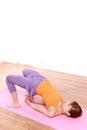 Young Japanese woman doing YOGA bridge pose Royalty Free Stock Photo