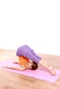 Young Japanese woman doing YOGA plow pose