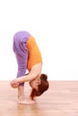 Young Japanese Woman Doing YOGA standing forward bend Royalty Free Stock Photo