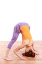 Young Japanese Woman Doing YOGA wide legged forward bend pose Royalty Free Stock Photo