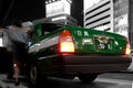 Waiting Toyota Crown taxi on a summer night in Tokyo. Royalty Free Stock Photo