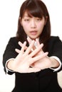 Young Japanese woman making stop gesture Royalty Free Stock Photo