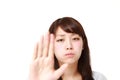 Young Japanese woman making stop gesture Royalty Free Stock Photo