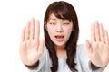 Young Japanese woman making stop gesture Royalty Free Stock Photo