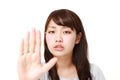 Young Japanese woman making stop gesture Royalty Free Stock Photo