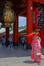 Young japanese woman in pink traditional kimono at Senso-Ji temple Royalty Free Stock Photo