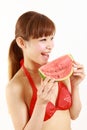 Young Japanese woman wearing bikini with watermelon