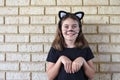 Young Jewish girl dressed up in a cat costume on Purim Jewish holiday