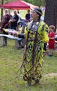 Woman Pow Wow Jingle Dancer in Jingle Dress and Beaded Moccasins Dancing in a Pow Wow in Evans, Georgia