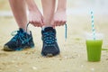 Young jogger with green vegetable smoothie Royalty Free Stock Photo