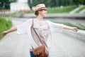 Young joyful happy traveler woman in straw hat enjoying her trip Royalty Free Stock Photo