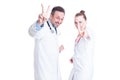 Young joyful medical coworkers gesturing victory