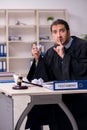 Young male judge working in courthouse