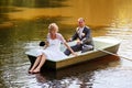 Young just married bride and groom on boat Royalty Free Stock Photo