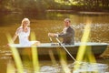 Young just married bride and groom on boat Royalty Free Stock Photo