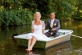 Young just married bride and groom on boat Royalty Free Stock Photo