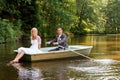 Young just married bride and groom on boat Royalty Free Stock Photo