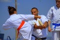 Young karate girl breaks a board Royalty Free Stock Photo