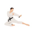 Young karate man in flying kick stance