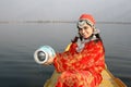 Young Kashmir Girl Collecting Water from Dal Lake