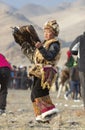 Young kazakh eagle hunter with his bird