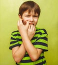 young kid child boy toothache pain in mouth, dental pain, holdin Royalty Free Stock Photo