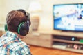 Young kid playing mass multiplayer game online Royalty Free Stock Photo