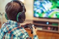 Young kid playing mass multiplayer game online Royalty Free Stock Photo