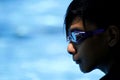 A young kid prepares to swim in a swimming pool. Royalty Free Stock Photo