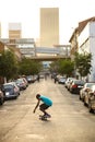 Young kid skateboarding in the empty streets of Maboneng Precinct in Central Johannesburg CBD Royalty Free Stock Photo