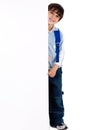 Young kid standing behind the board Royalty Free Stock Photo