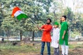 Young kids and boy of different age and different religion hearing tricolor dress and holding Indian National flag. Royalty Free Stock Photo