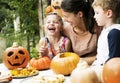 Young kids carving Halloween jack-o`-lanterns Royalty Free Stock Photo