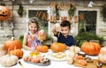 Young kids carving Halloween jack-o`-lanterns Royalty Free Stock Photo