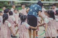 Young Kids exercise with hoola hoop.