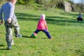 Young Kids Kicking Colorful Soccer Ball in Field Royalty Free Stock Photo