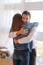 Young kind man looking happy while hugging his beautiful wife Royalty Free Stock Photo