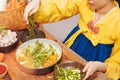 Young Korean women in golden hanbok cook traditional kimchi dishes using fresh and quality ingredients and ingredients : Pickled v