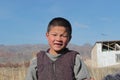 Young kyrgyz boy looking into the camera