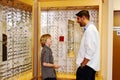 Young lad talking with optometrist Royalty Free Stock Photo