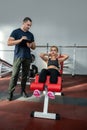 The young lady came to the gym to get in shape and get rid of cellulite to a qualified trainer Royalty Free Stock Photo