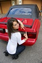 Young lady with convertible sports car