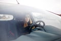 Young lady driving a car in winter