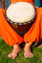 Young lady drummer with her djembe drum. Royalty Free Stock Photo