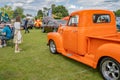 Young lady admiring a custom pickup truck