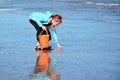 Gathering shells on beach Royalty Free Stock Photo