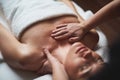 Young lady have low neck massage in spa salon Royalty Free Stock Photo