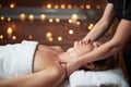 Young lady have massage of neck in spa salon Royalty Free Stock Photo