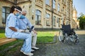 Young lady helping the senior man using the laptop Royalty Free Stock Photo