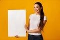 Young Lady Holding Blank White Board On Yellow Background Royalty Free Stock Photo